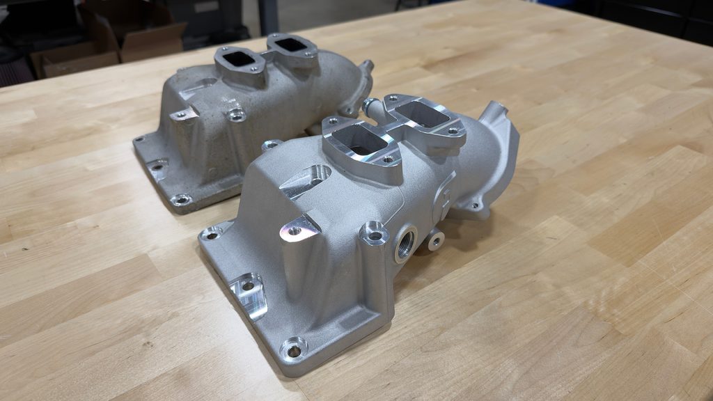 Fleece RAM Cummins Intake for 2007-2024 6.7L on table with stock chassis cab intake